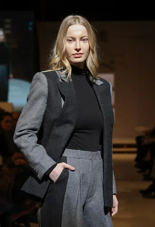 Runway close-up of the colour-blocked grey wool suit