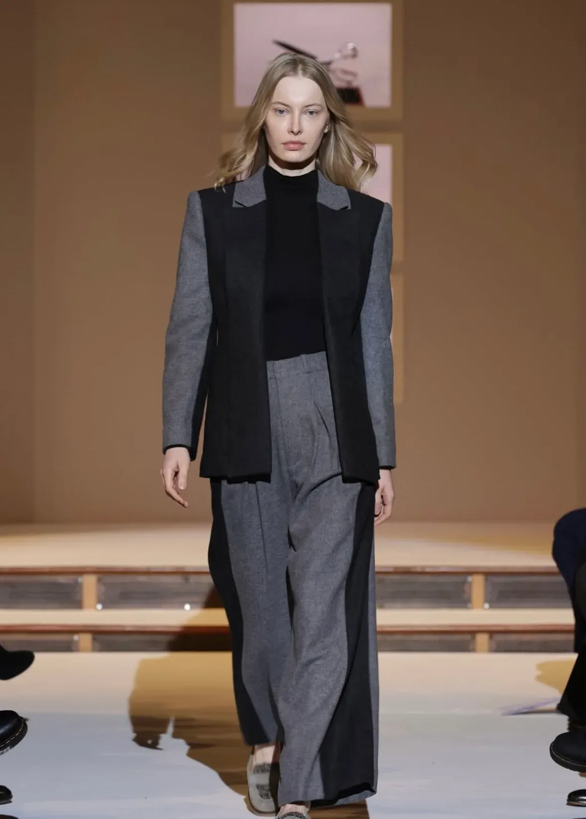 Runway front view of the colour-blocked grey wool suit