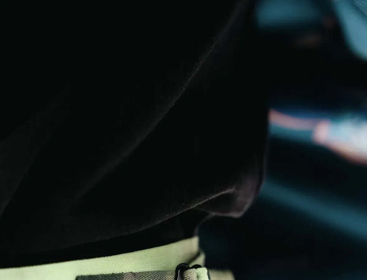 Close detail of the tie-dye green jacket belt and waistband
