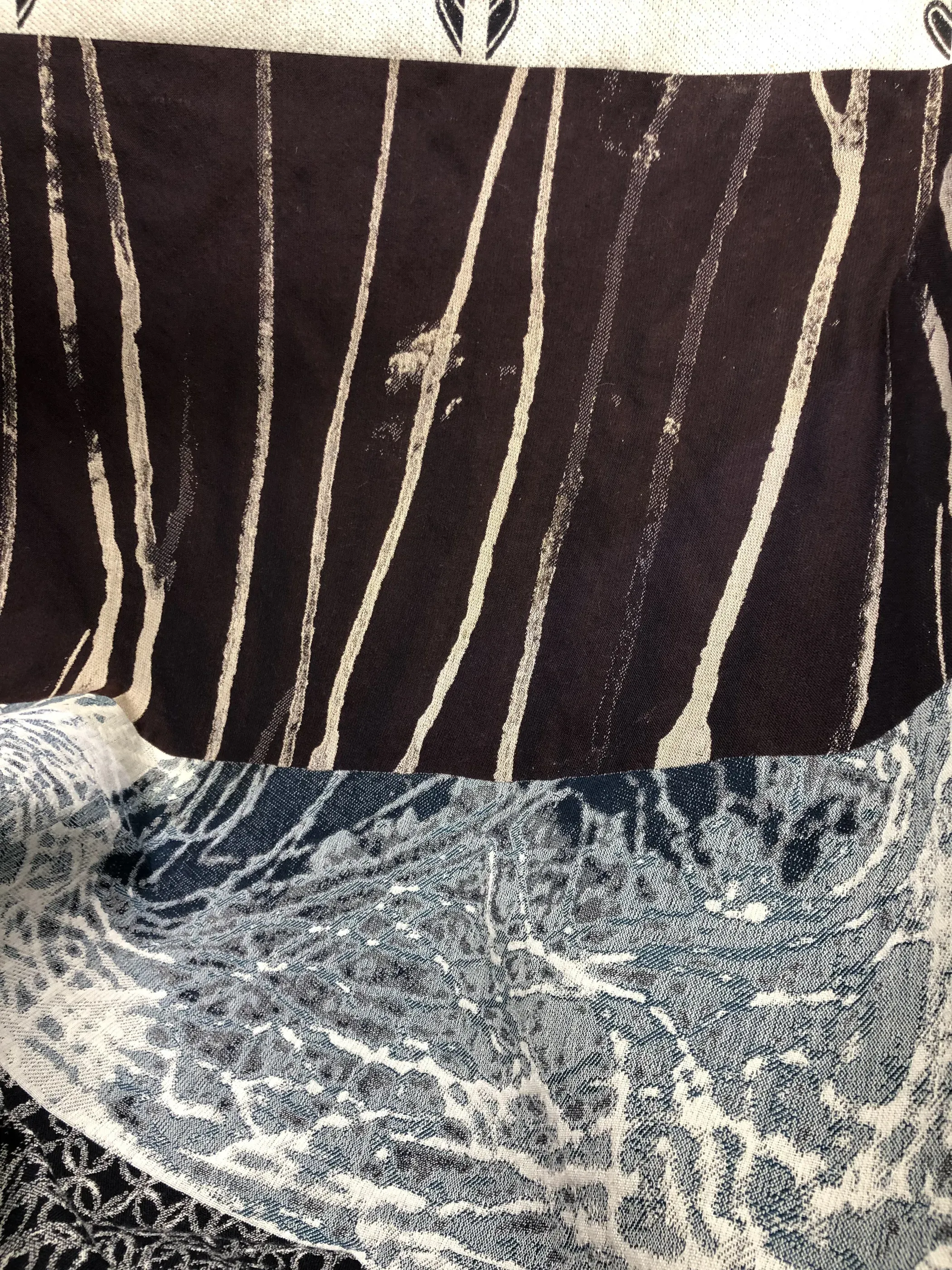 Macro detail of the striped and jacquard fabrics used across the collections
